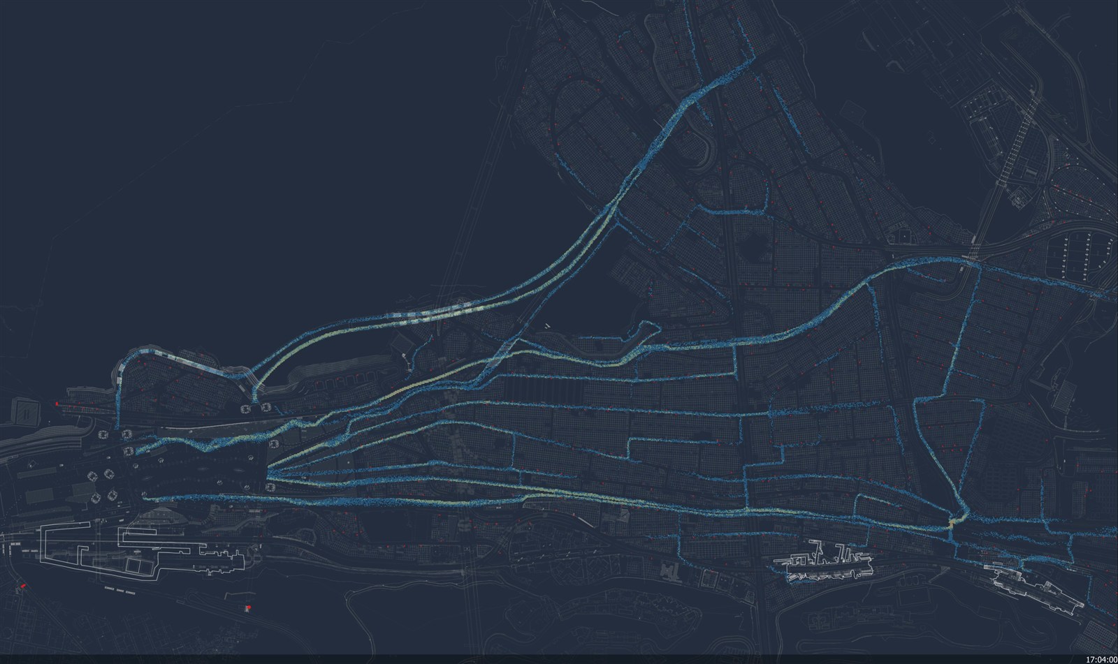 Screenshot of the pilgrim simulation, with colored pedestrian markers following a connected network of routes around the Jamarat area.